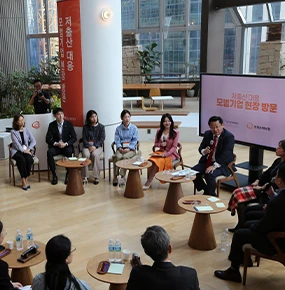 Female entrepreneurs in a discussion circle, looking to create femtech innovations and drive global impact.