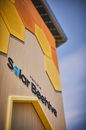 A close-up view of the Hanwha Solar Beehive logo.