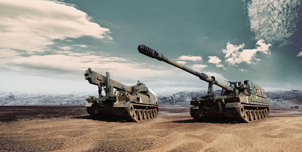 Hanwha Aerospace&rsquo;s K9 howitzer and K10 ammunition resupply vehicle on display outdoors