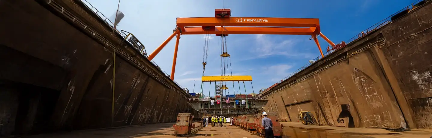 A Goliath crane lifting a part of a vessel at Hanwha Philly Shipyard