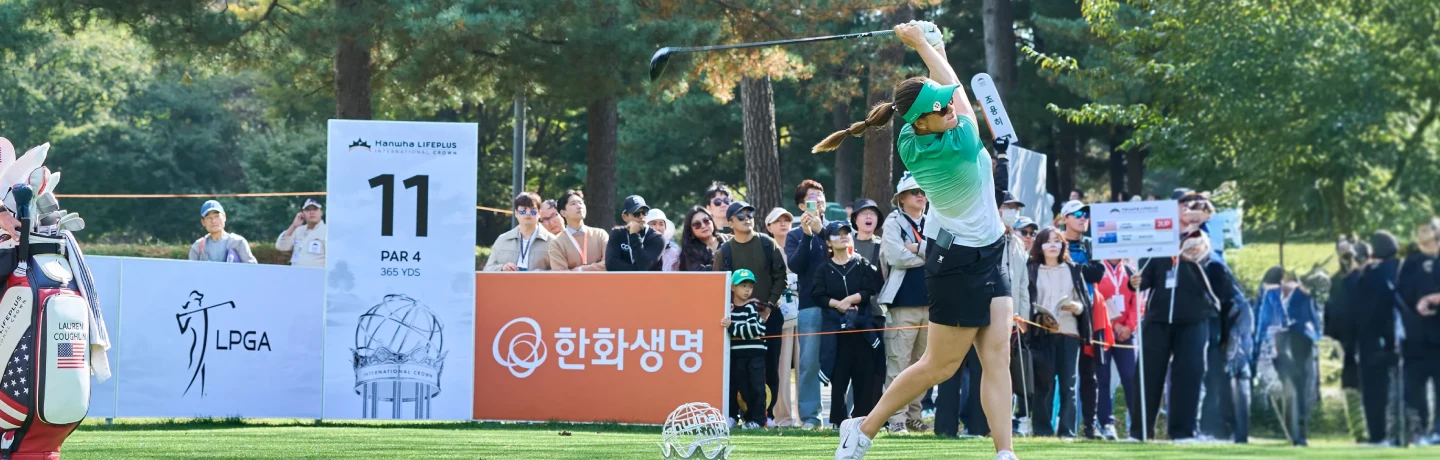 An Australian golfer tees off as spectators watch during the 2025 Hanwha LIFEPLUS International Crown.